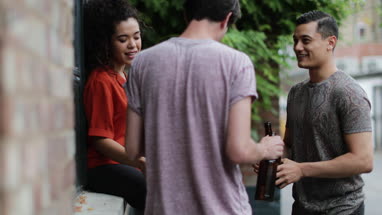 Millennials drinking beer in pub garden
