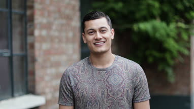 Portrait of millennial male outdoors on street