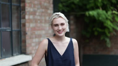 Portrait of millennial female outdoors on street