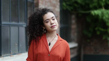 Portrait of generation z female outdoors on street