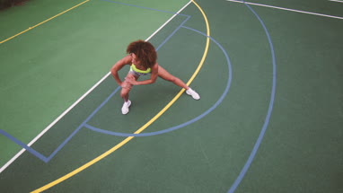 Overhead shot of young adult female stretching before sports