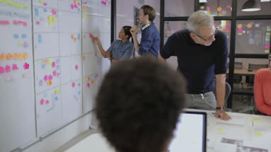 Coworkers working late in an office