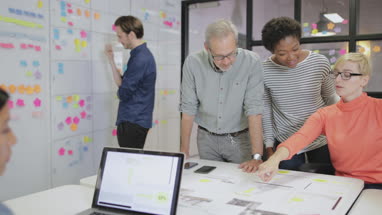Coworkers working late in an office