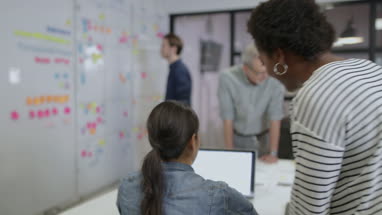 Coworkers working late in an office