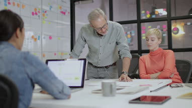 Coworkers working late in an office