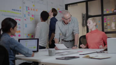 Coworkers working late in an office