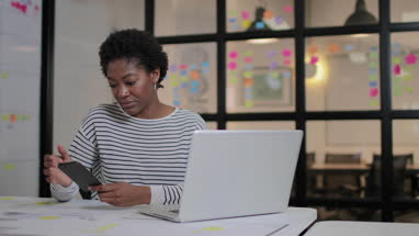 African American female working late in an office