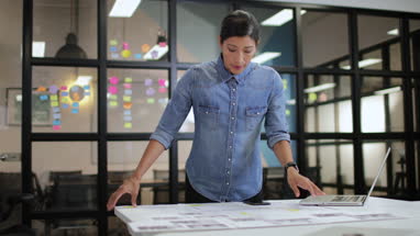 Businesswoman working late in the office on a presentation