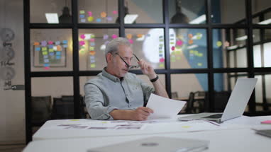 Mature male working late in an office