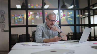 Mature male working late in an office