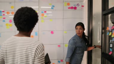 Coworkers arriving for a team meeting