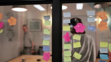 Happy coworkers leaving a team meeting