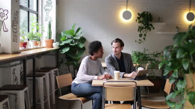Coworkers having a meeting in a cafe