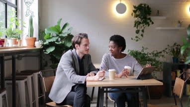 Coworkers having a meeting in a cafe