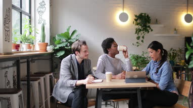 Coworkers having a meeting in a cafe