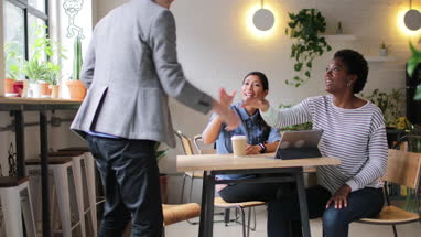 Coworkers meeting in a cafe