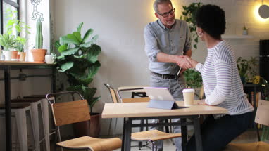 Coworkers having a meeting in a cafe