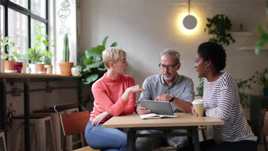 Coworkers having a meeting in a cafe