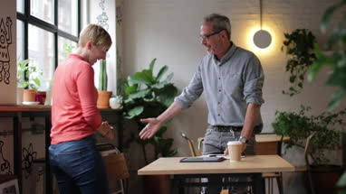 Young adult having an informal job interview in a cafe