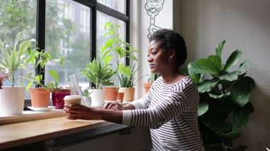 Freelance african american businesswoman working in a cafe