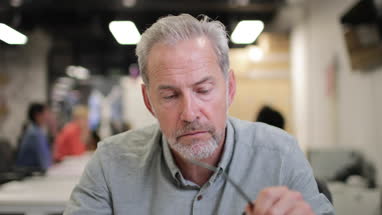 Mature businessman on a videocall in an office