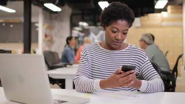 African American female working late in an office