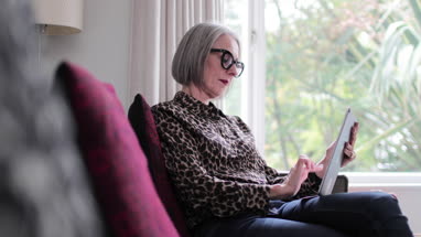 Mature adult female shopping online