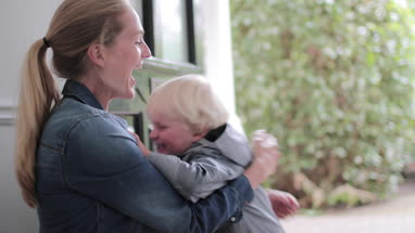 Child running to Mum in hallway