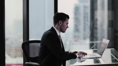 Businessman working in executive office in a skyscraper