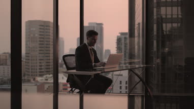 Businessman working in executive office in a skyscraper