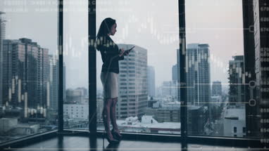 Conceptual shot of businesswoman with infographics digital composite