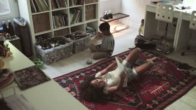 African American kids playing in bedroom