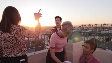 Group of friends gathering on a rooftop for a celebration