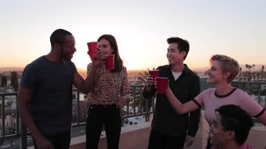 Group of friends gathering on a rooftop for a celebration