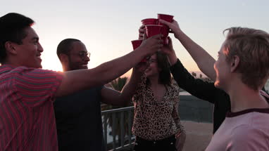 Group of friends gathering on a rooftop for a celebration