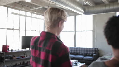 Young lesbian couple looking at an apartment together