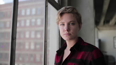 Portrait young female in loft apartment