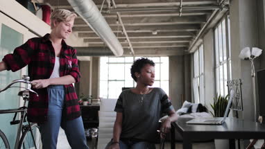 Young adults studying together in a loft apartment