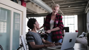 Young adults studying together in a loft apartment