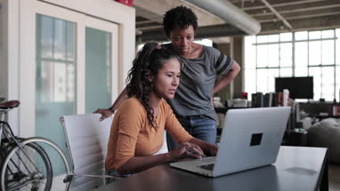 Young adults studying together in a loft apartment