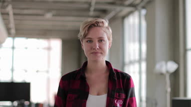 Portrait young female in loft apartment