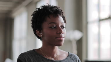 Portrait of young african american female in loft apartment