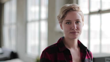 Portrait young female in loft apartment