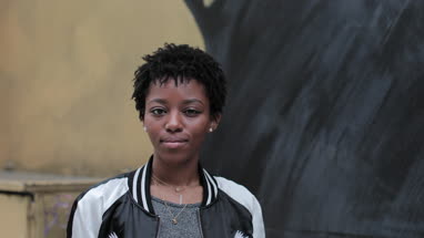 Portrait of African American young adult female outdoors